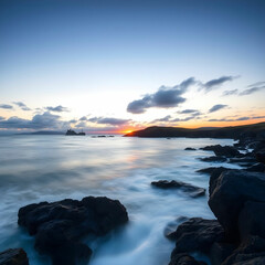 Fototapeta premium Long exposure shot of the seascape in Guernsey during a sunset