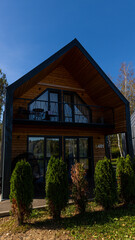 A residential house that features a roof resembling a barn style