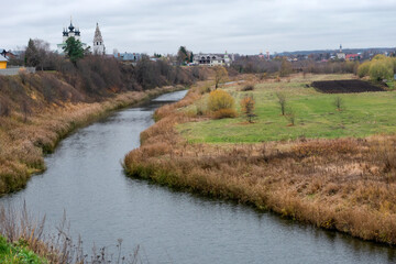 View of the Kamenka River and the Cathedral of the Nativity of the Blessed Virgin Mary in the Kremlin of Suzdal on an autumn day, Vladimir region, Russia