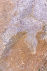 Detailed photo of granite stone surface. Close up texture of natural stone.