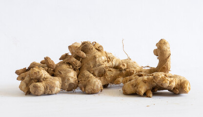 ginger roots on white background