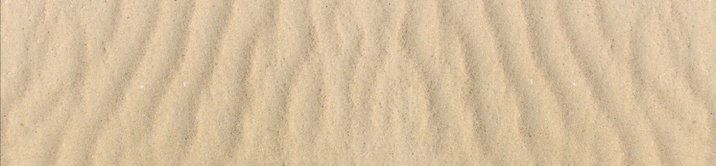 Sand texture. Sandy beach for background. Top view. Natural sand stone texture background. sand on the beach as background. Wavy sand background for summer designs.