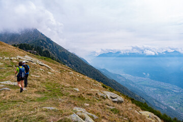 Trekking scene on a mountain between Valtellina and Lake Como