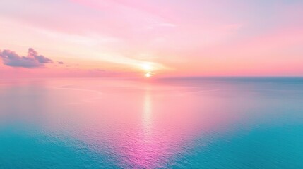Obraz premium A breathtaking sunset paints the sky in hues of pink and orange, reflecting off a calm sea and creating a scene of breathtaking beauty.