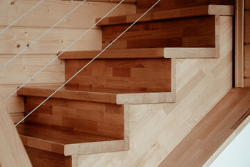 Modern wooden staircase design in a contemporary home showcasing natural materials and craftsmanship