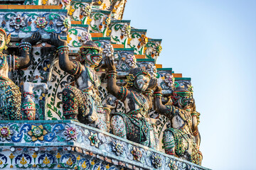 The prang of Wat Arun is decorated with brightly colored tiles creating a beautiful art. It is a beautiful and unique architecture of Bangkok, located on the banks of the Chao Phraya River. Thailand
