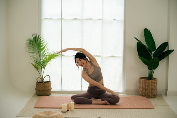 Asian woman yoga routine at Yoga studio