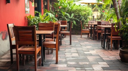 Outdoor seating area of a South Asian restaurant, no people, with plenty of room for copy space.