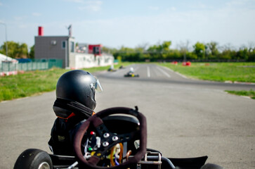 Children's sports competitions in karting. Training meal. Children's sports car