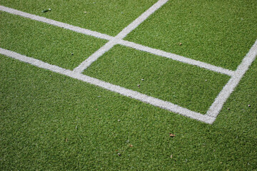Obraz premium tennis court covered with artificial grass close up