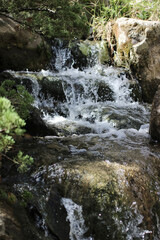 water fall flowing between rocks close up