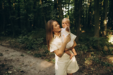 A mother and daughter walking in the forest