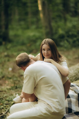 Obraz premium A happy family spends time in the forest