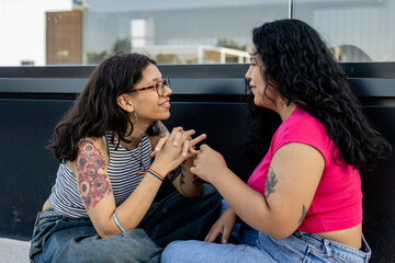 Lesbian couple sitting talking with each other