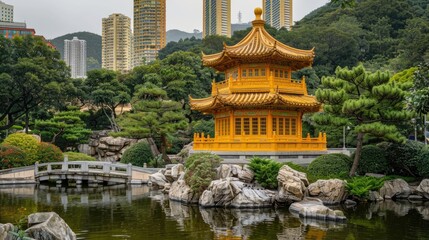 Fototapeta premium A traditional yellow pagoda sitting on calm water, surrounded by lush greenery