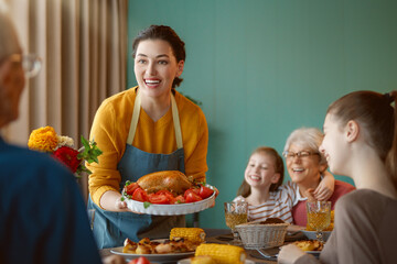 Family celebrating Thanksgiving Day