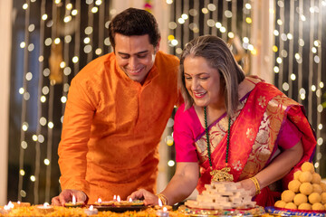 Mother with son enjoying diwali at home