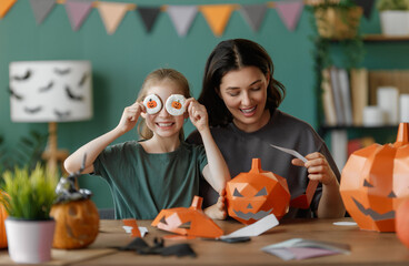Happy family preparing for Halloween.