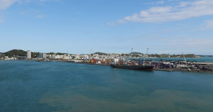 Noumea, port container terminal and the city in the background. New Caledonia.