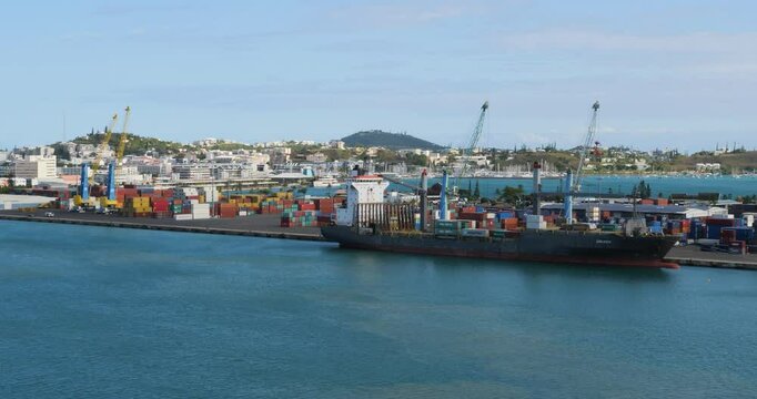 Noumea, port container terminal and the city in the background. New Caledonia.