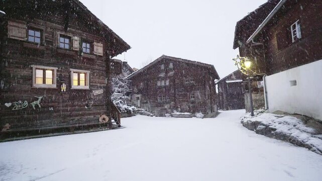Traditional Wooden Houses With Snowfall During Winter In Blatten bei Naters, Switzerland. wide shot
