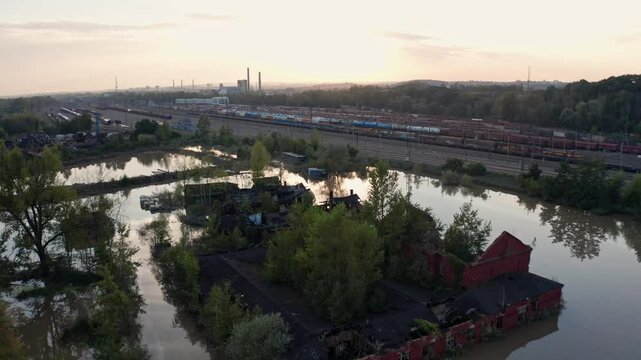 Drone shot over flooded train station and ruined house in Ostrava