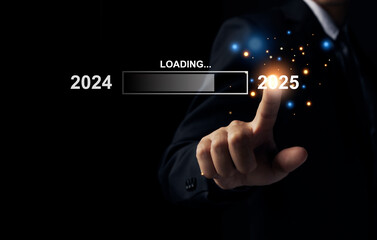 Businessman pointing to 2025, loading bar for count down from 2024 to 2025 year, Start up business...