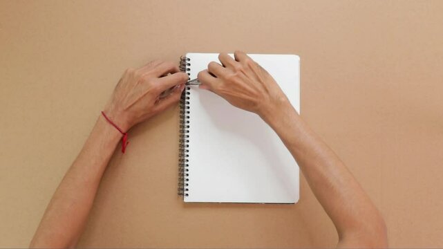 Making a notebook by hand, spiral binding with pliers