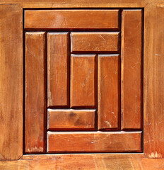 Detail of window shutter with square elements and beautiful wooden texture