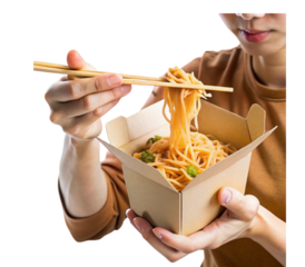 Woman eating noodles with chopsticks from take away box