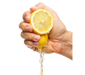 Hand squeezing lemon juice from a freshly cut lemon