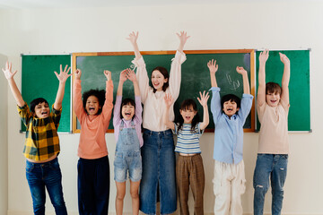 Fototapeta premium Diverse Young Pupils and Enthusiastic Educator Express Excitement during School Day, Fostering Inclusive Learning Environment