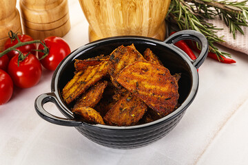 Golden baked potato Idaho with spices