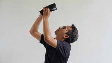 asian man checking an empty wallet