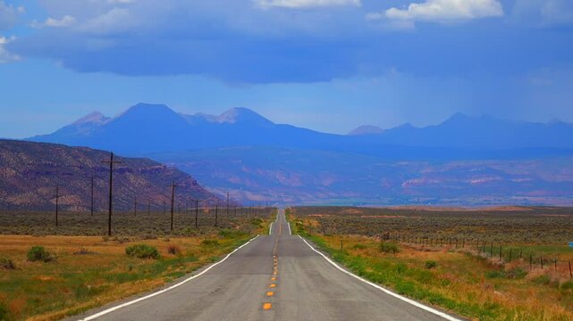 Colorado Utah Border slow stair still motion highway 90 road Moab Spanish Valley La Sal Mountain Rocky Mountains road Telluride Montrose county dry sun summer Redvale Norwood rain thunderstorm clouds