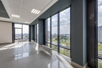 Fototapeta premium panorama view in empty modern hall with columns, doors and panoramic windows