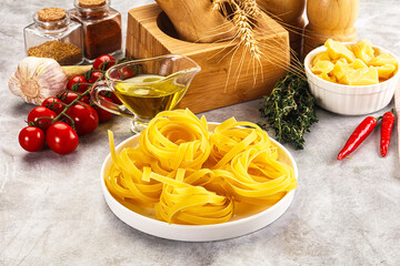 Raw dry Italian pasta - pappardelle