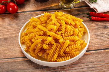 Italian dry pasta Fussili for bowl