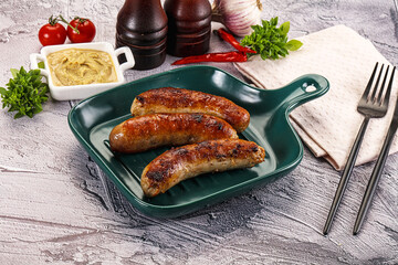 Delicous natural roasted sausages in the plate