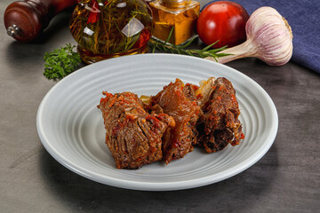 Baked beef ribs with vegetables