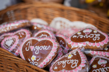Gingerbread hearts with inscription i love you in the basket. Traditional czech sweet dessert gingerbread at the Gingerbread shop in Prague. 