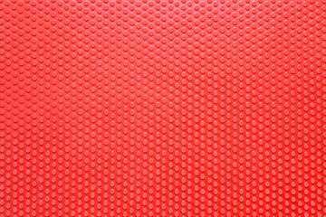 Obraz premium Red dot rubber background for table tennis racket