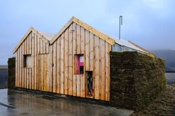 Fototapeta premium Wooden petrol station in Iceland against blue sky