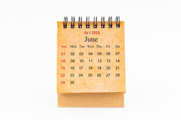 Brown mini desk calendar for June 2025 isolated on white.