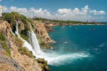 Lower Duden Waterfall in Duden Park, which flows from the cliffs in Antalya, Turkey into the Mediterranean Sea