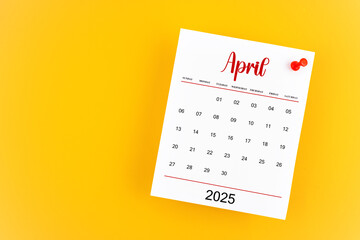 April 2025 calendar page with red push pin on yellow background.