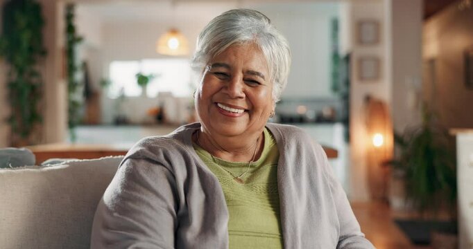 Retirement, elderly woman and happy in home for comfort, thinking and reflection. Senior person, smile and portrait in living room for memories, nostalgia or peace on sofa with pride for pension