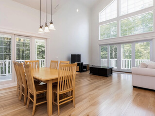 Interior of living room with dining area and hanging lamps
