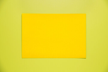 Yellow paper sheet for mockup on green background