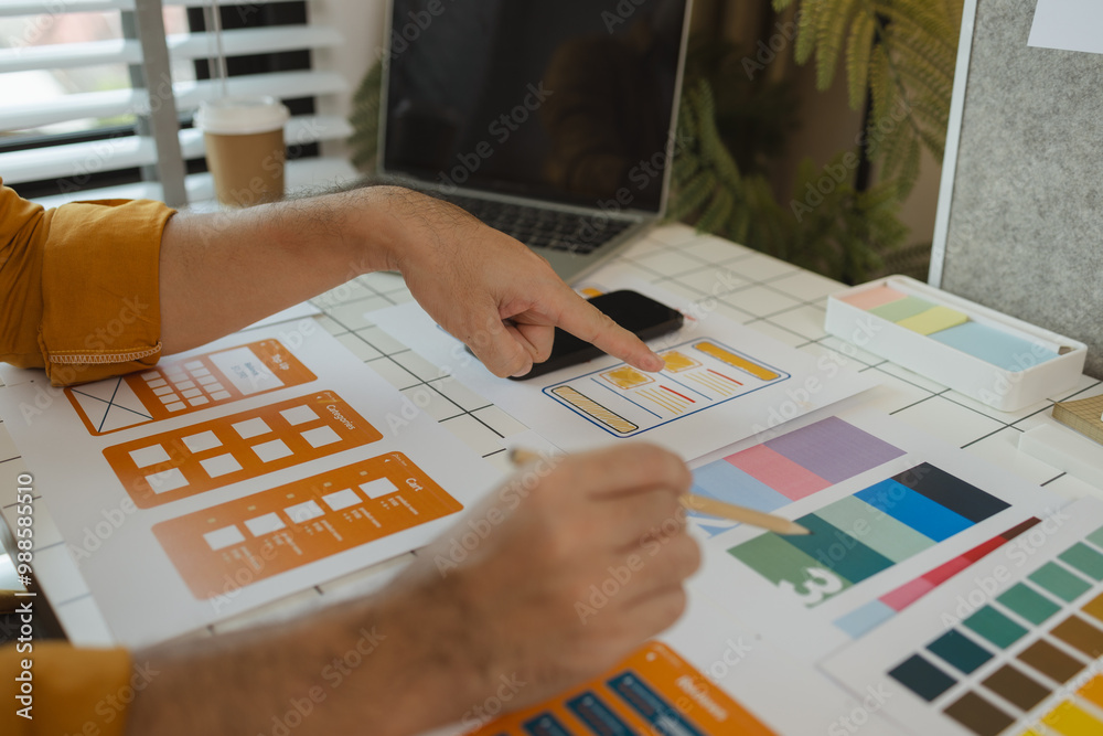 Wall mural a web designer is using his idea to create a digital product design project that will meet the needs